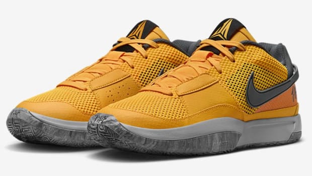 Side view of Ja Morant's yellow, grey, and black Nike shoes.